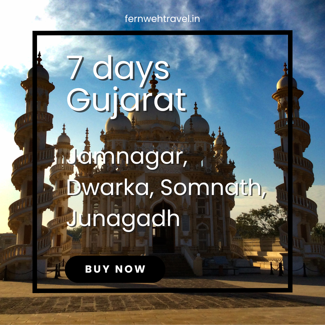 View of Mahabat Maqbara complex in Junagadh, showcasing intricate Islamic-Gothic architecture with minarets and domes under a clear blue sky.