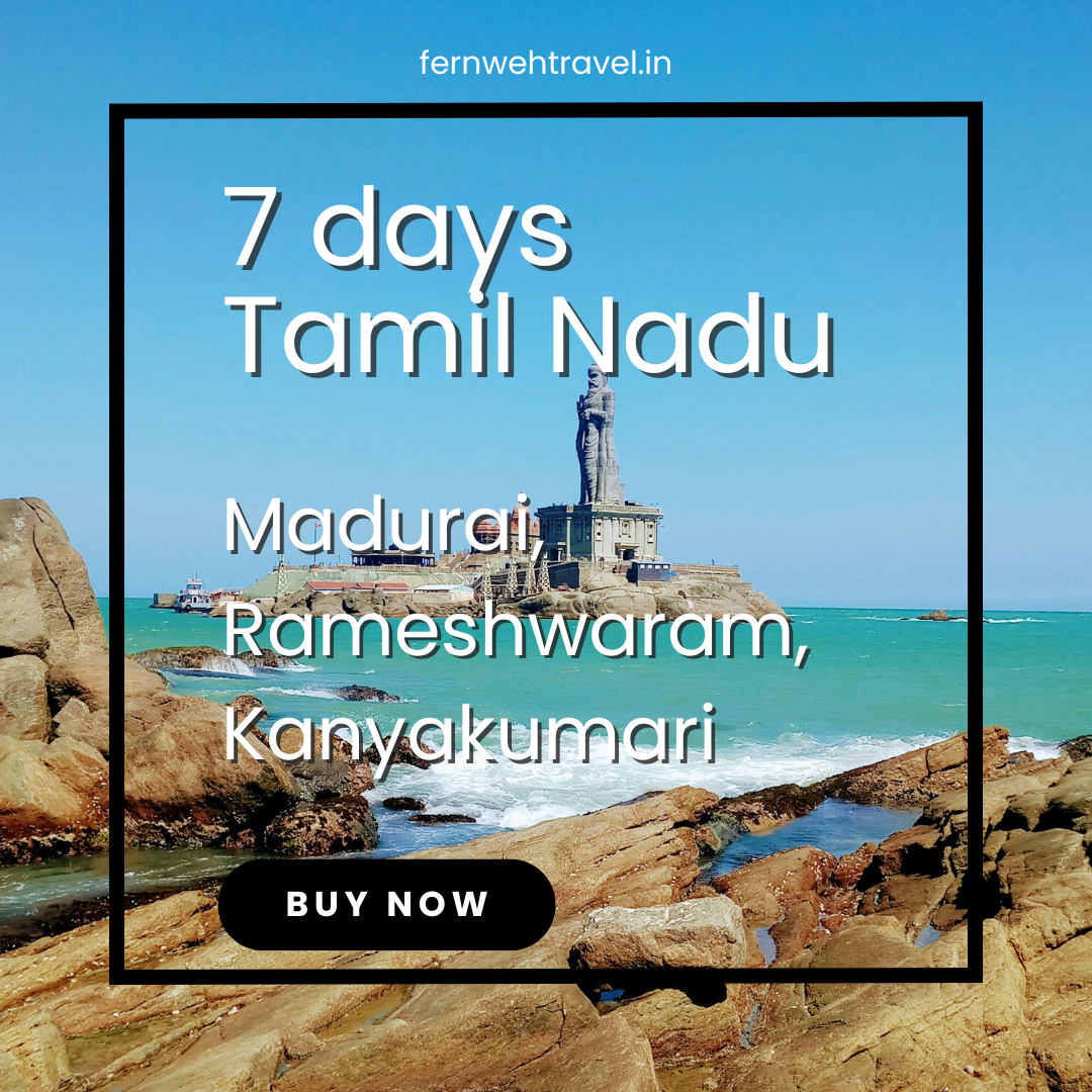 Thiruvalluvar Statue towering over the sea in Kanyakumari, with blue skies and ocean waves symbolizing wisdom and serenity.